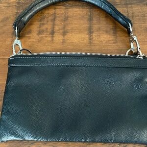 Leather clutch small handbag. With paisley lining